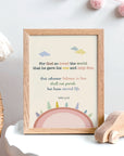 John 3:16 nursery wall art with pink earth and trees illustration displayed in a baby's room