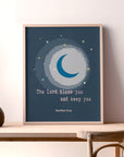 Moon and star nursery wall art with Numbers 6:24 blessing displayed in a baby's room