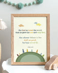 John 3:16 nursery wall art with earth and trees illustration displayed in a baby's room
