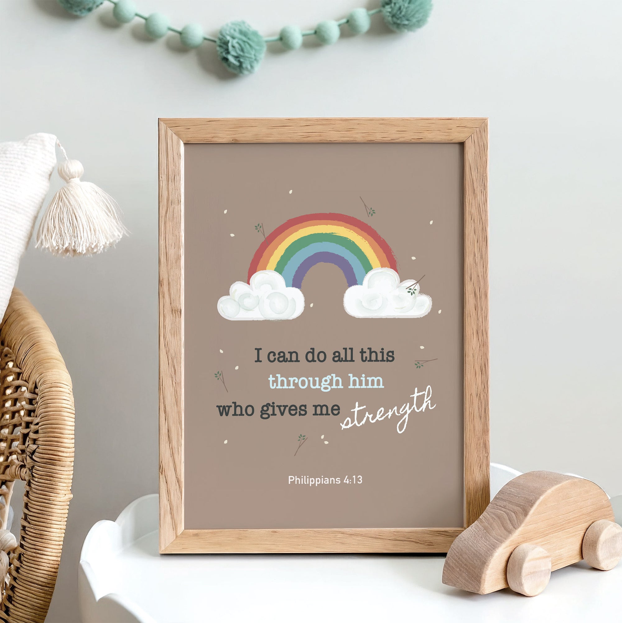 Colorful rainbow kids wall art with Philippians 4:13 displayed in a child's bedroom