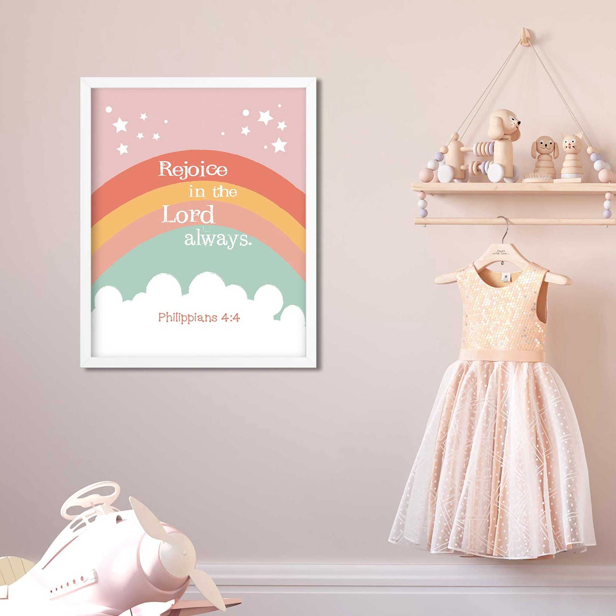 Christian kids room decor featuring Philippians 4:4 boho rainbow wall art